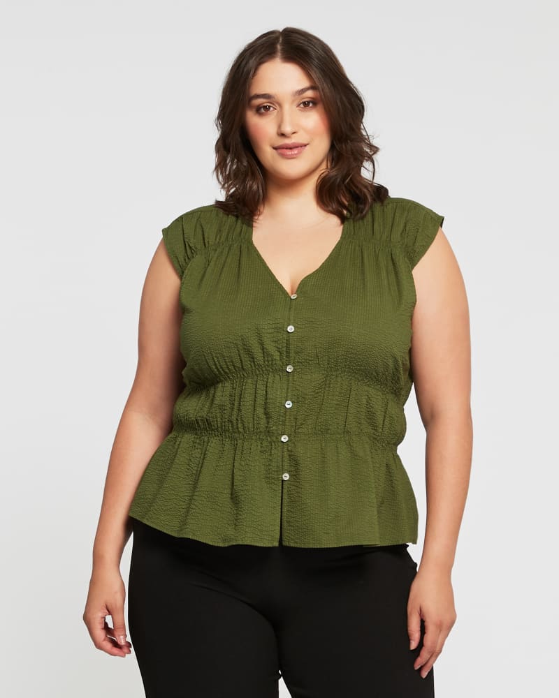 Front of a model wearing a size 1X Costa Del Sol Top in Olive by Estelle. | dia_product_style_image_id:264751